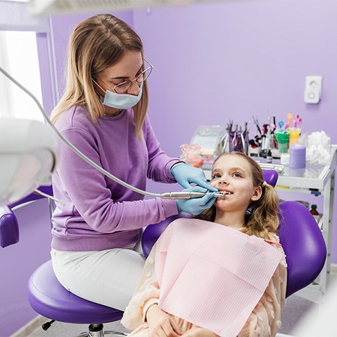 A child receiving dental treatment