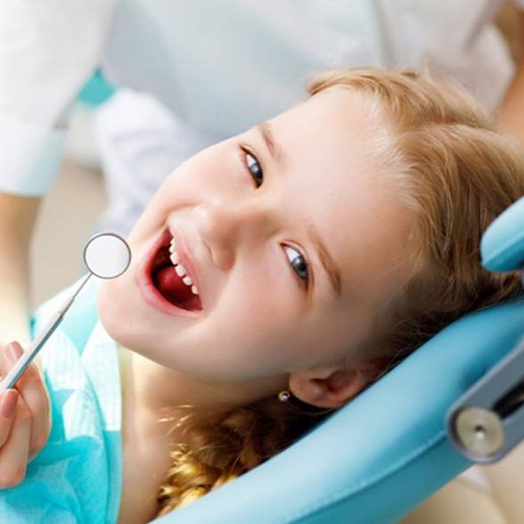 a child visiting her dentist for a tooth extraction