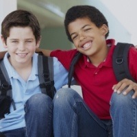 Two preteen boys smiling