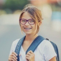 Preteen girl with braces smiling