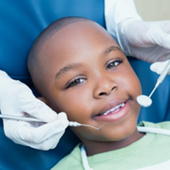 Closeup of young boy smiling during dental checkup