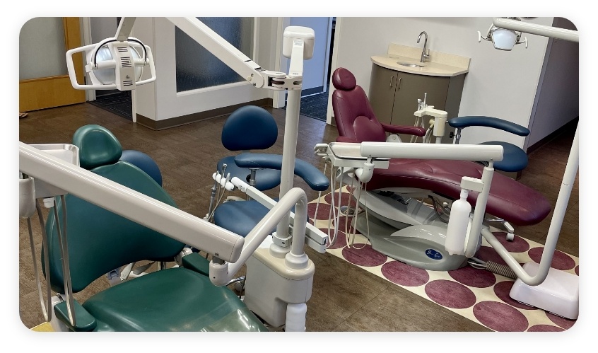 Two children's dental treatment chairs next to each other