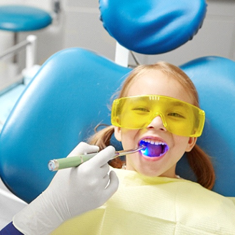 Worcester pediatric dentist applying dental sealant