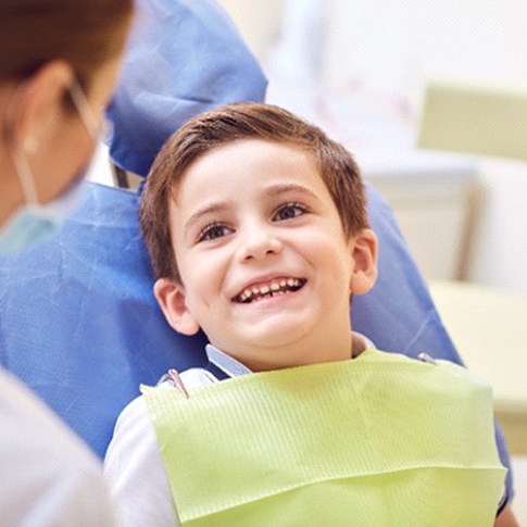 Boy smiling at pediatric dentist in Worcester
