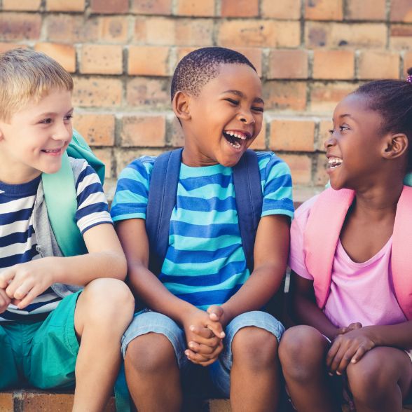 Kids laughing together after pediatric dental services in Worcester Massachusetts