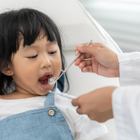  a young child during a dental exam