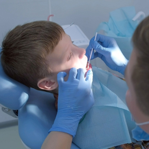 a child receiving fluoride treatment