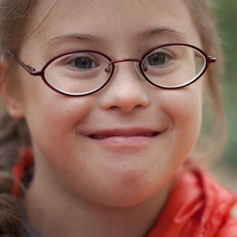 Young person smiling after special needs dentistry visit