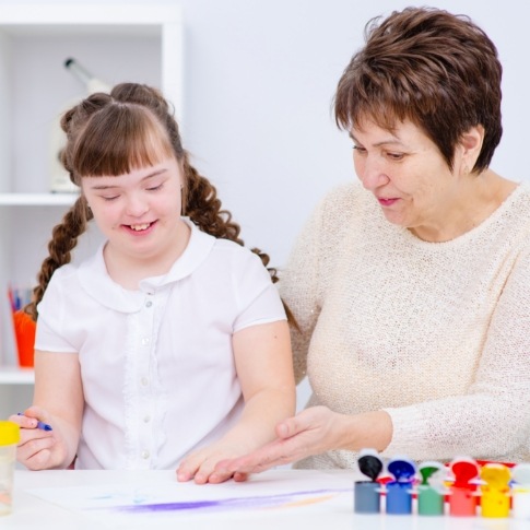 Mother and child in waiting room before special need dental visit