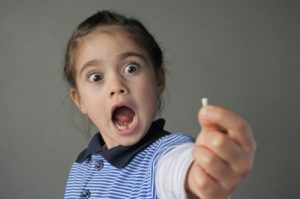 a child after losing a baby tooth