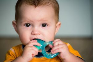 a child feeling discomfort due to teething 