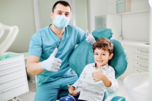 a child smiling during a dental checkup