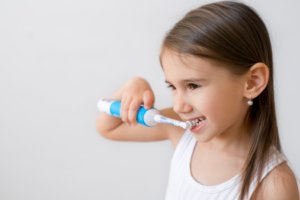 a child brushing their teeth