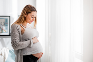 a pregnant woman smiling 